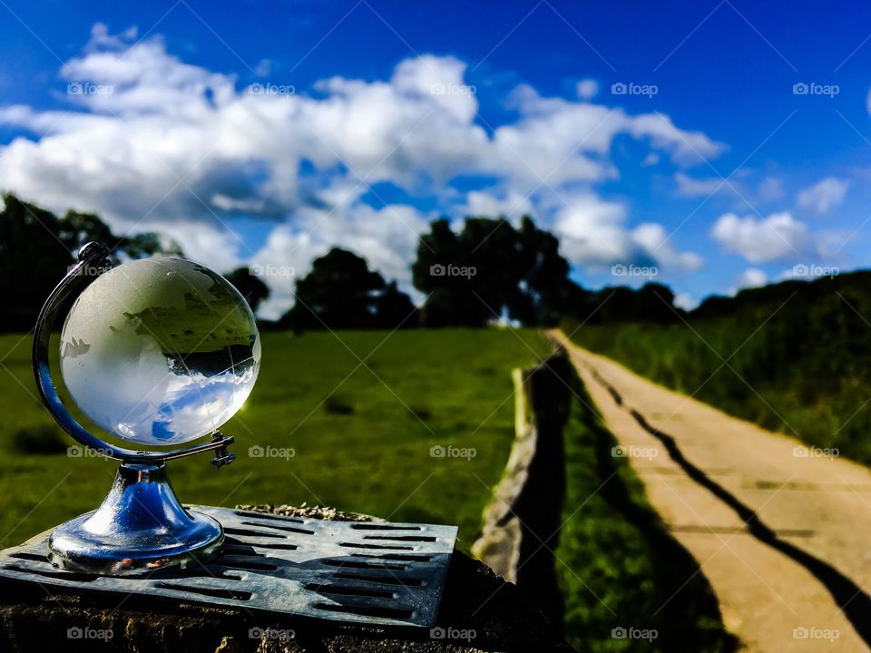 Close-up of crystal globe in field