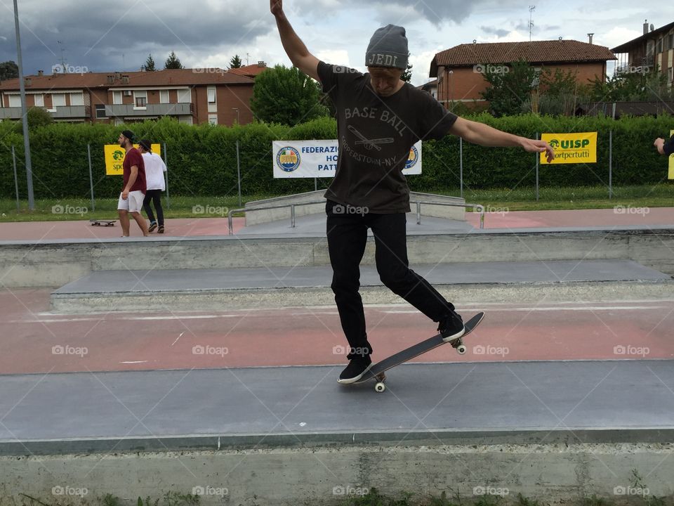 Young skate boarder in skate park