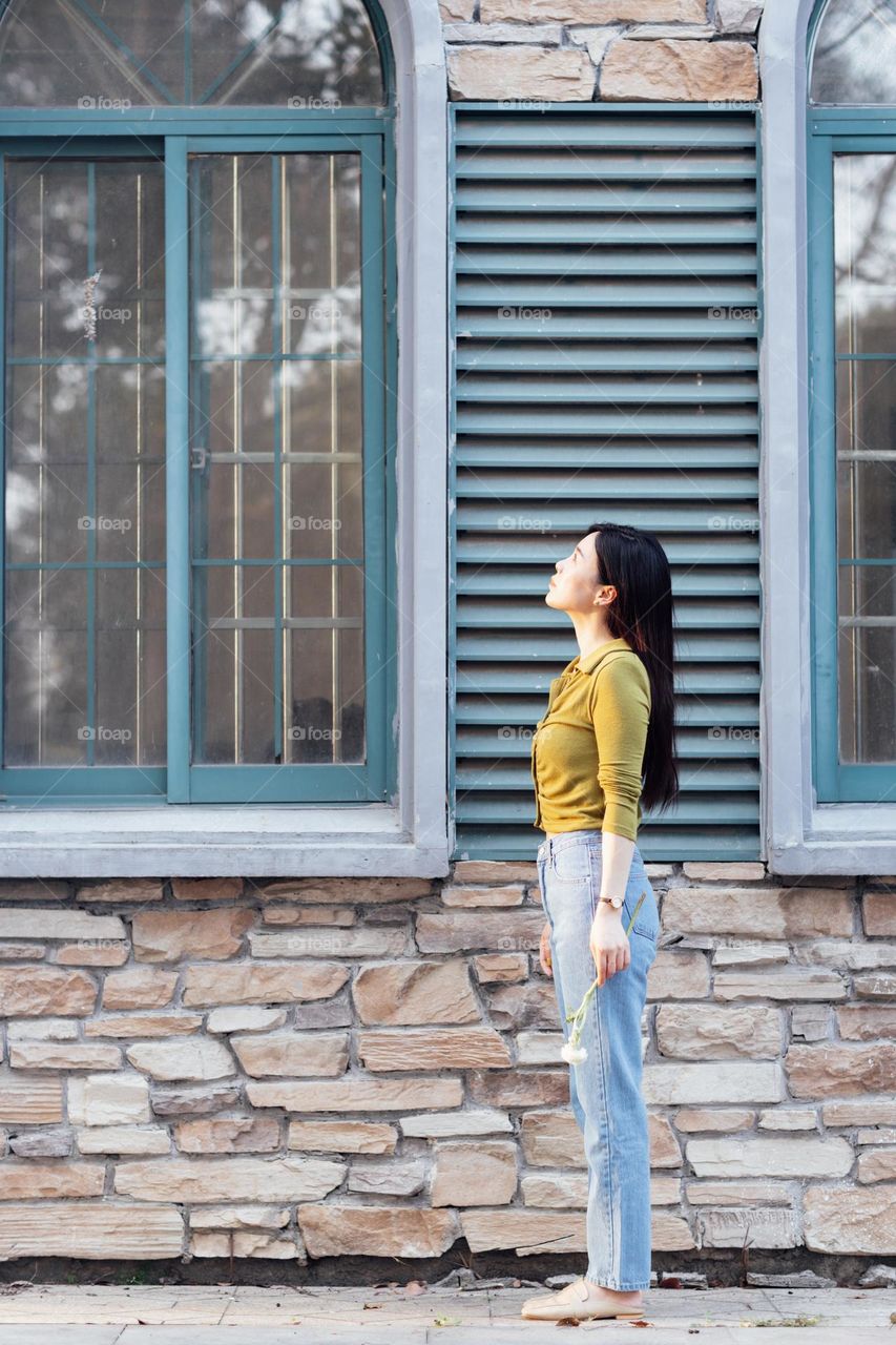 Stylish woman near building