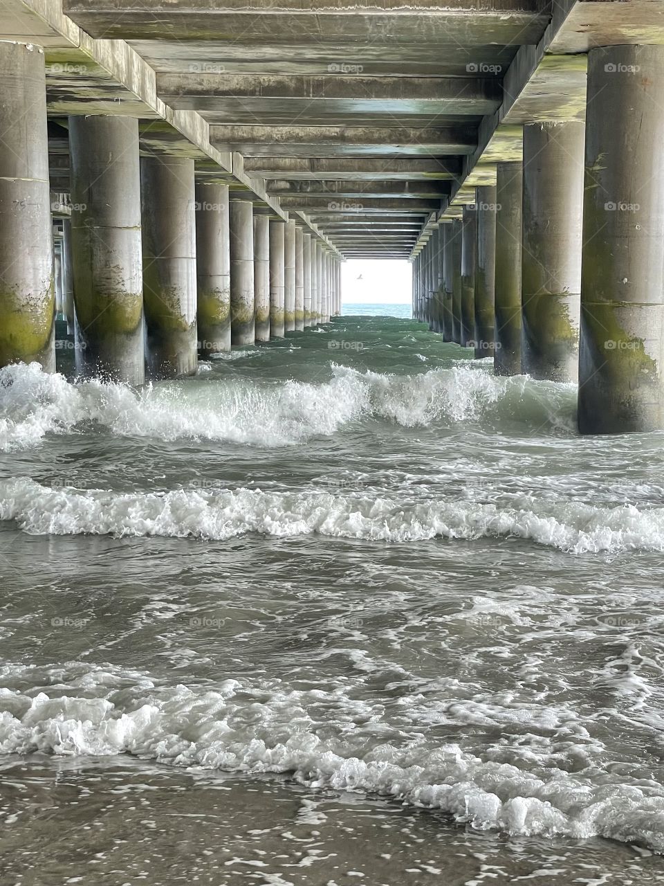Rough waves under a pier
