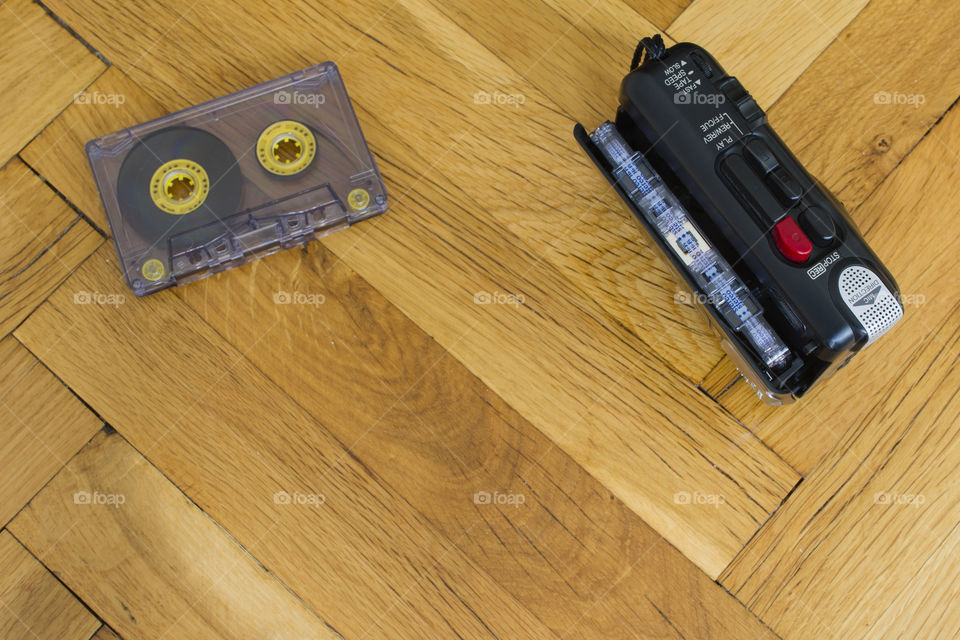 cassette voice recorder and cassette on parquet