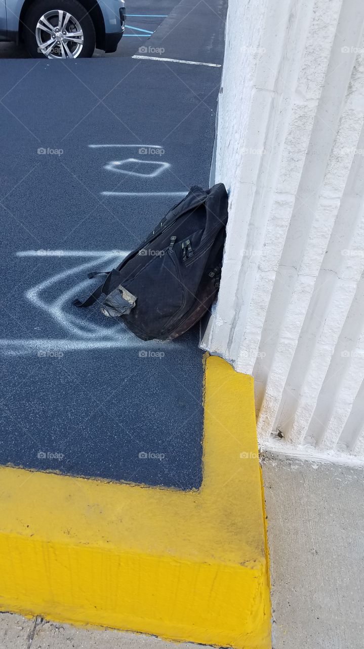 backpack against a wall