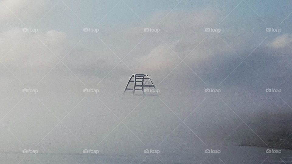 Bridge emerging from the mist, almost as if above the clouds. Is it a bridge to nowhere?