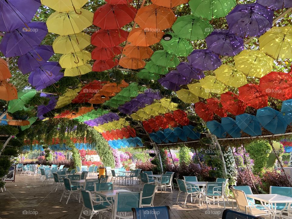 Coloured umbrella over the tables in the bar . Dubai 
