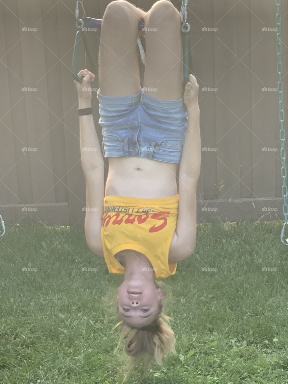 My crazy daughter on the swing set 