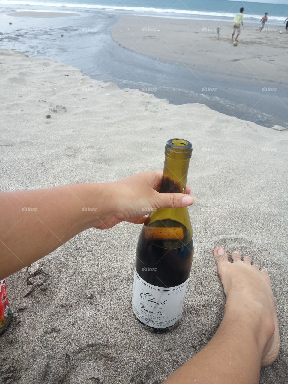 enjoying a bottle of Etude wines on the beach.