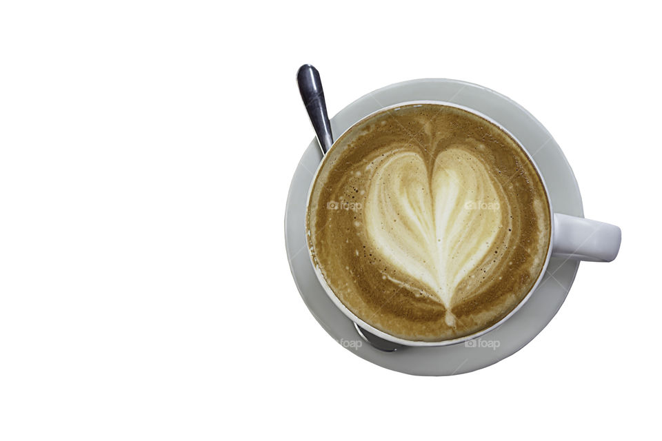 Hot coffee Espresso topped with a heart-shaped milk in white glass on a white background with clipping path.