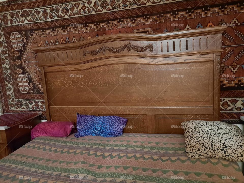 decoration carved on the headboard of the bed