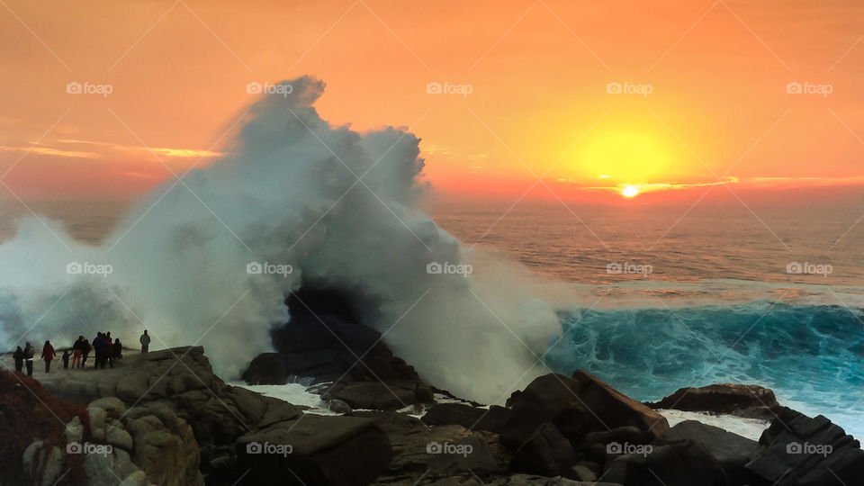 Big wave at a beautiful sunset 