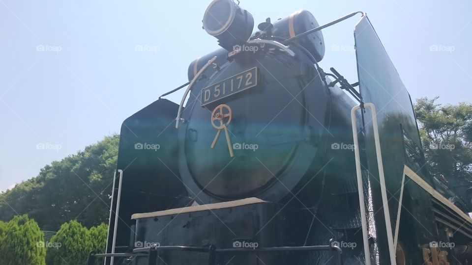 Close-up of a steam train engine