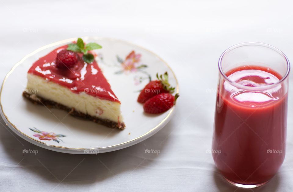 red cheesecake and strawberry juicea
