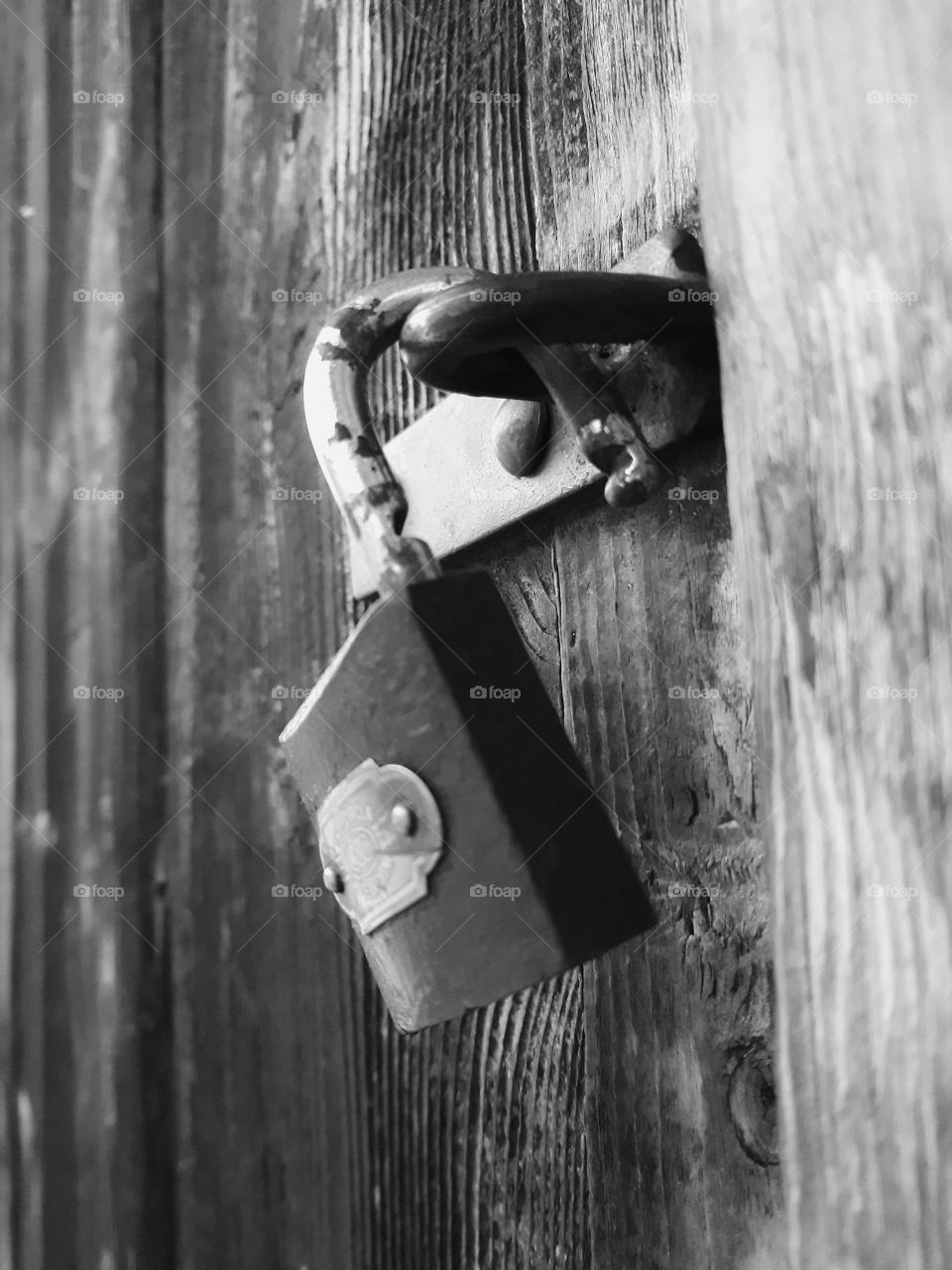 Black and white rusty and old padlock