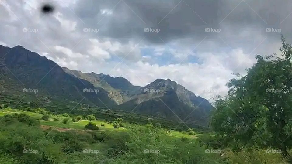 Glory be to God, the magnificent and picturesque view and the natural green trees are a view that is nothing more wonderful than it