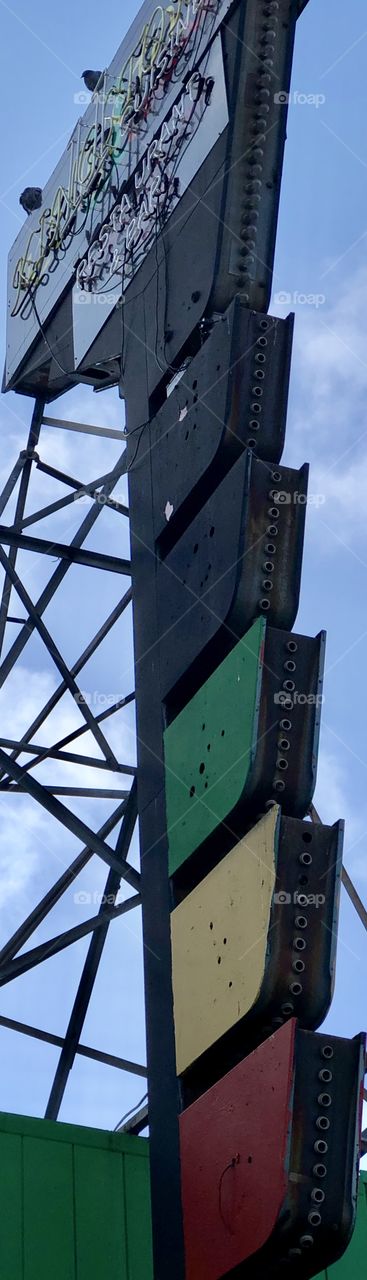 Lightbulb sockets on the side of a decorative restaurant sign. In Oakland ca