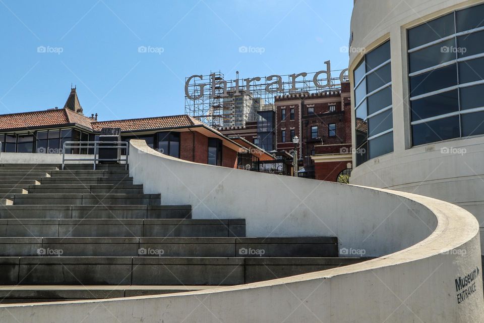 View of Ghirardelli Square from aquatic park in San Francisco California, curved architecture and steps looking up