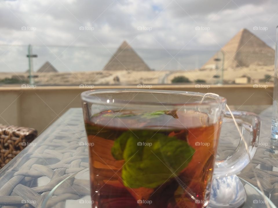 a great day in Great Giza Pyramids morning drinks coffee & and Egyptian tea with mint 
this is Egyp