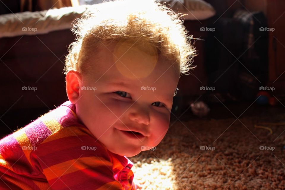 Little sunshine. Happy baby. sunshine in the hair.