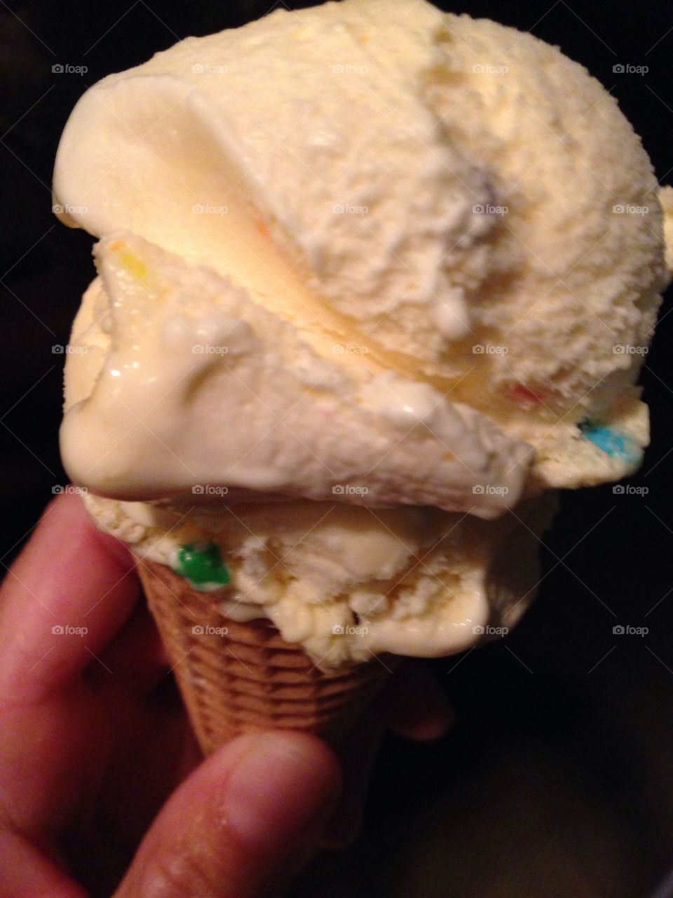 Sprinkles of sweetness. Birthday cake ice cream cone