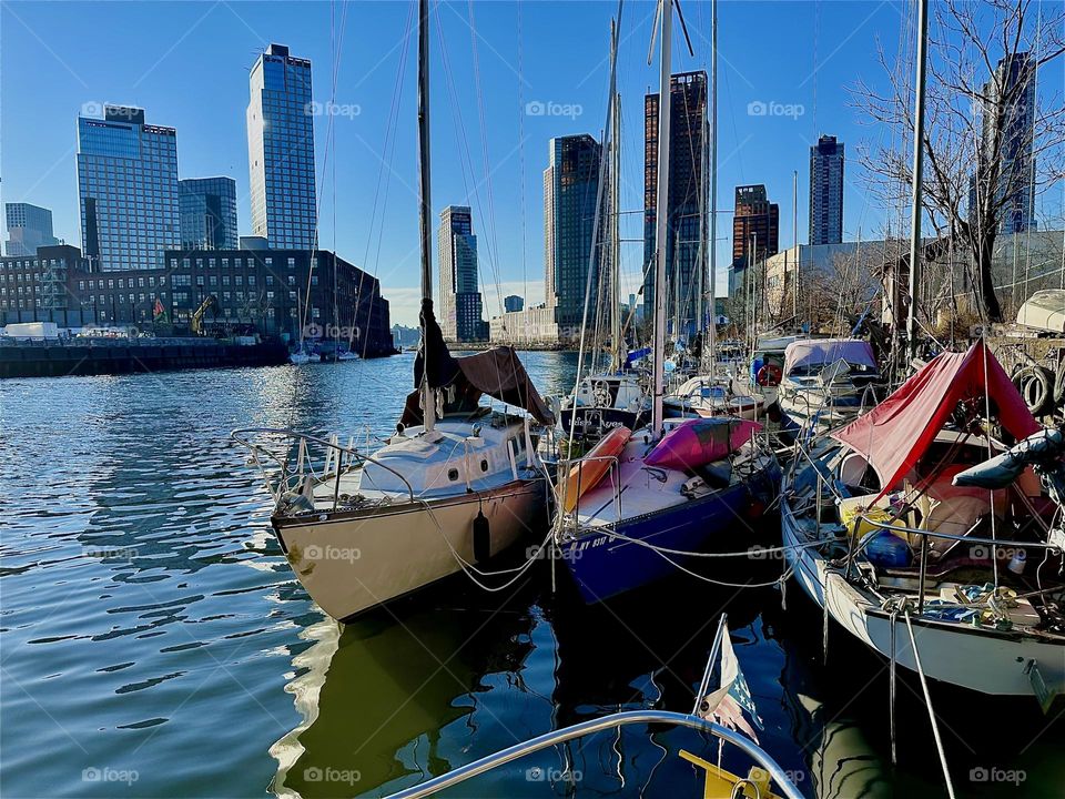 This is “Newtown Creek” in LIC, Queens with its many boats that are tied to the shore here seen from aboard one of them, the “Salvation”, the “28 ft 1969 Luhrs” cabin cruiser that I and partner “Timothy Trespas” call home. 2023. Hypnotic Productions