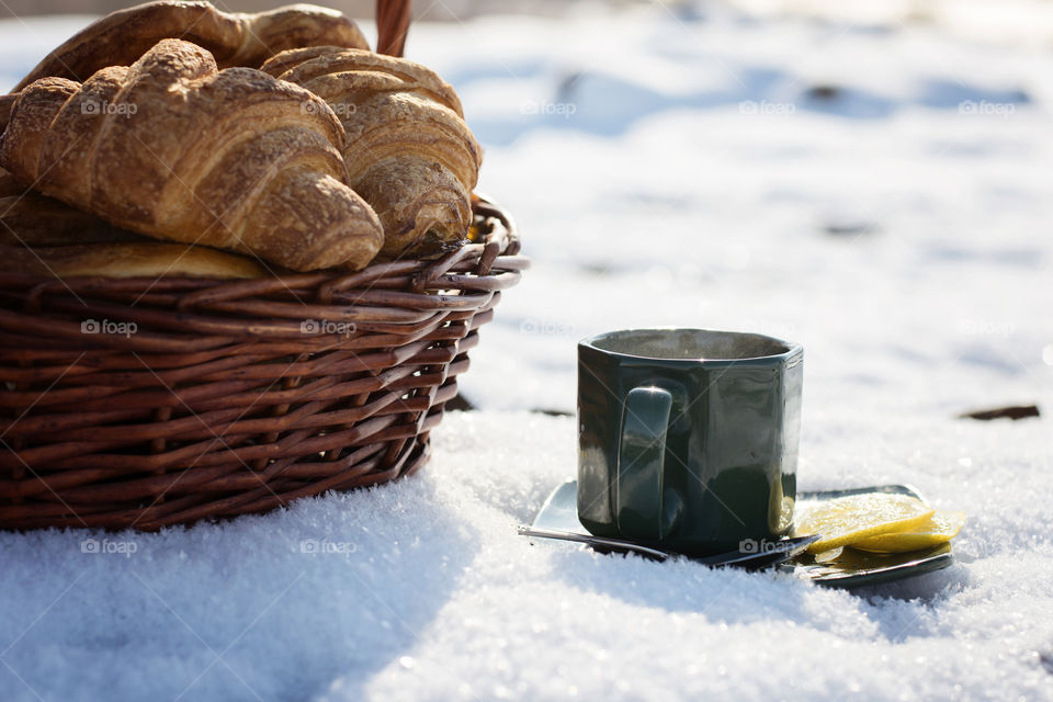 Lemon tea and croissants in winter