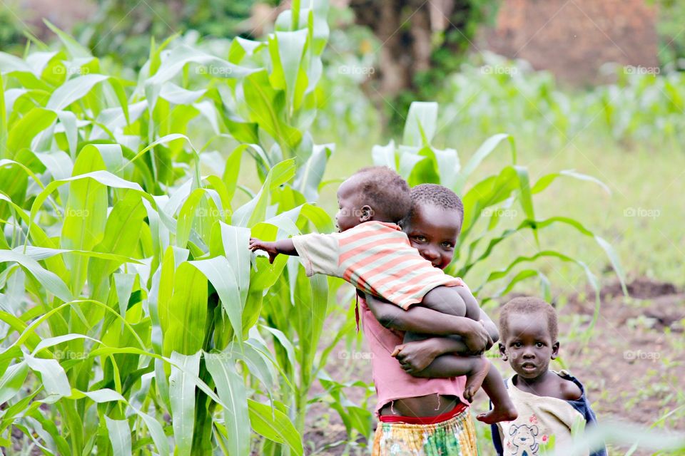 Farm Life. Wandering around we found these children playing in the community behind clinic 