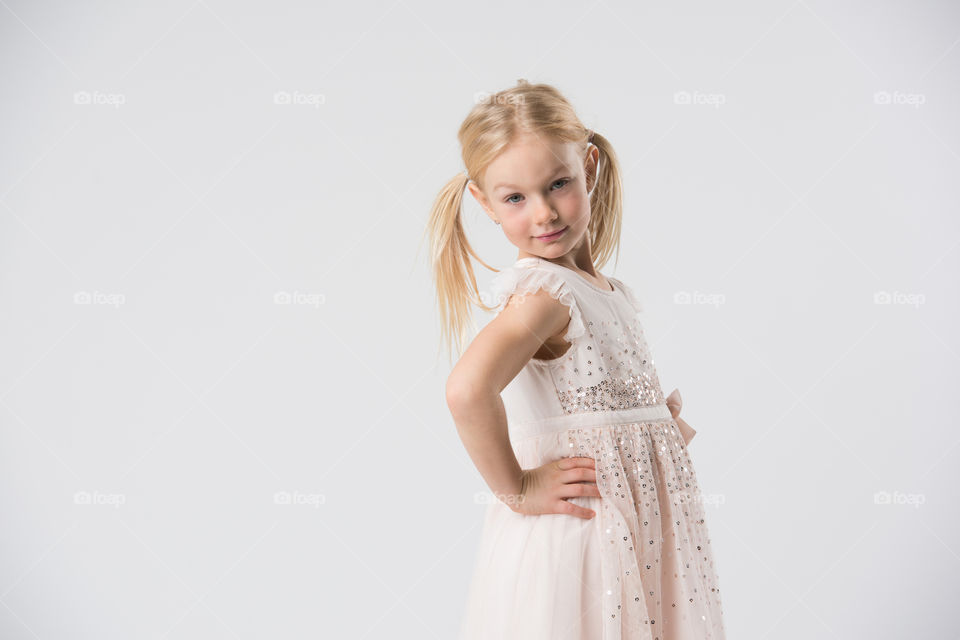 6 year old child model posing in a studio.