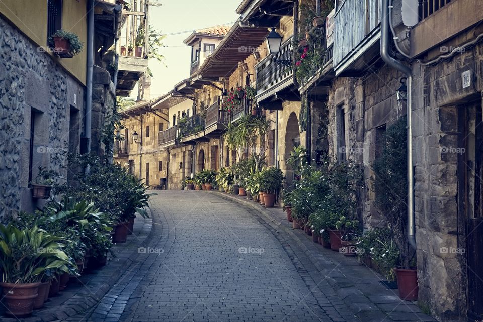 Narrow alley in a small medieval town called Cartes, Spain