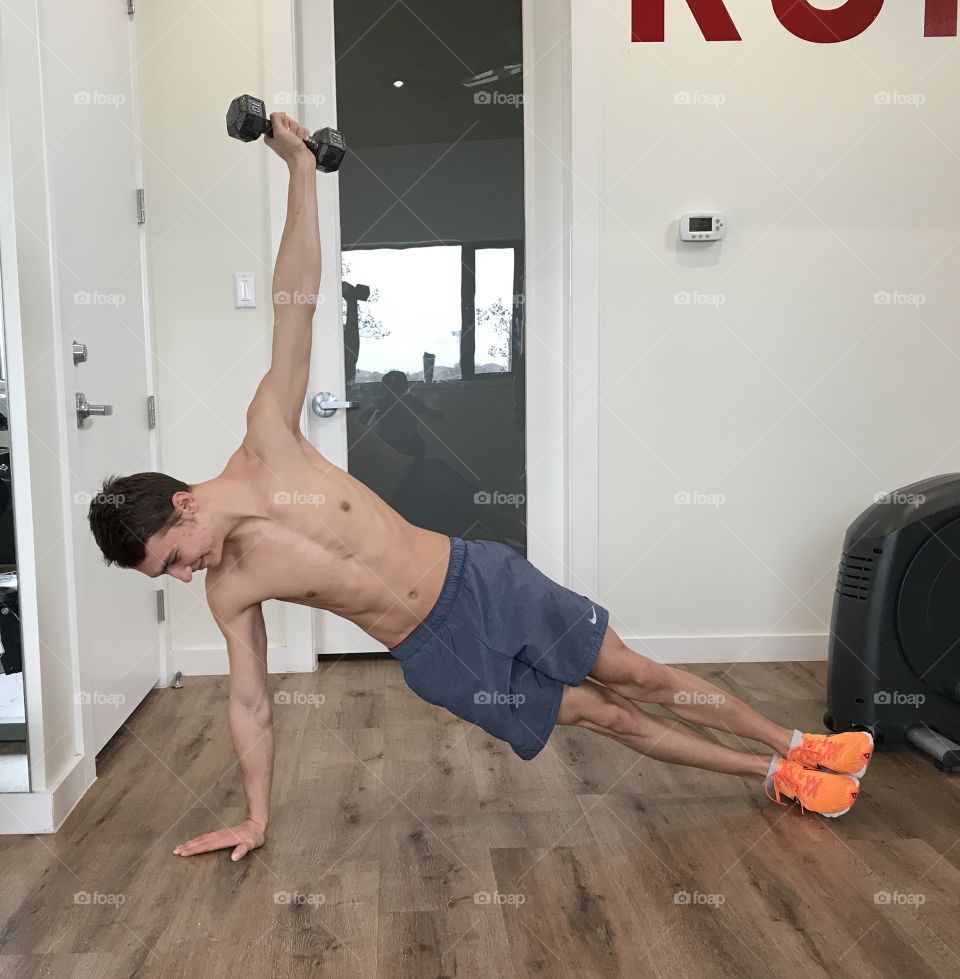 Side plank with weight