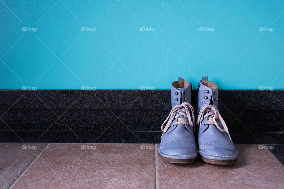 Vintage blue boots on the hallway 