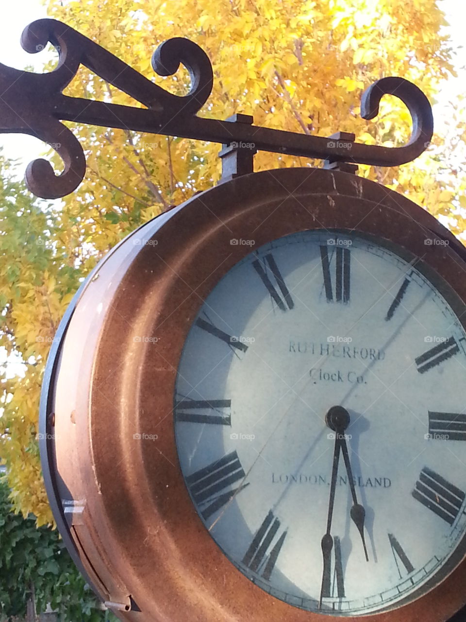 Time for Fall. A clock with autumn leaves