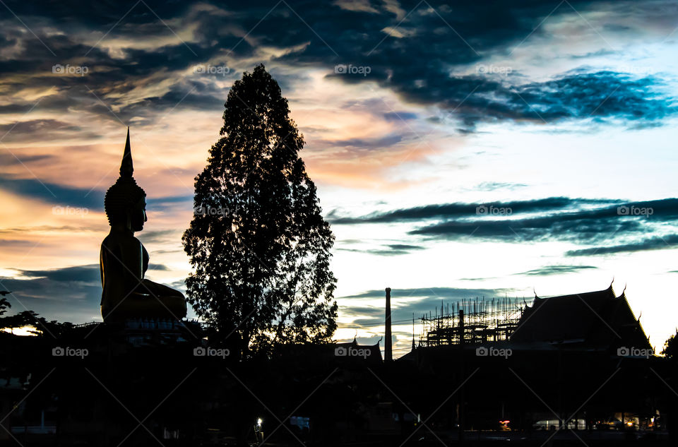 Sunset behind Wat Lad Pha Dook , Temple in Nonthaburi , Thailand.