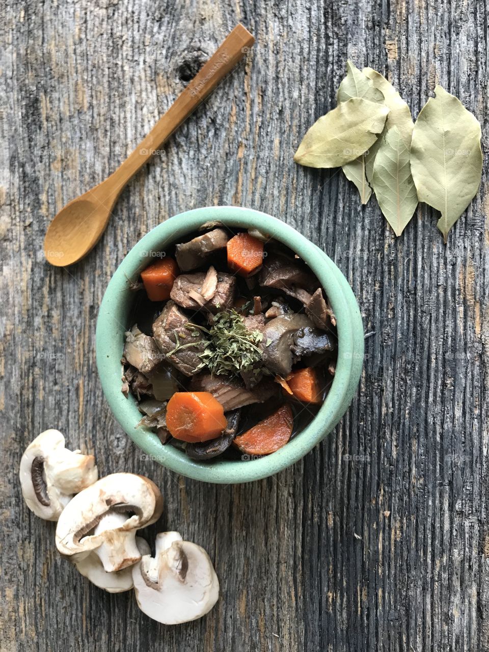 A green bowel filled with stew perfect for dinner on a cold winter evening.