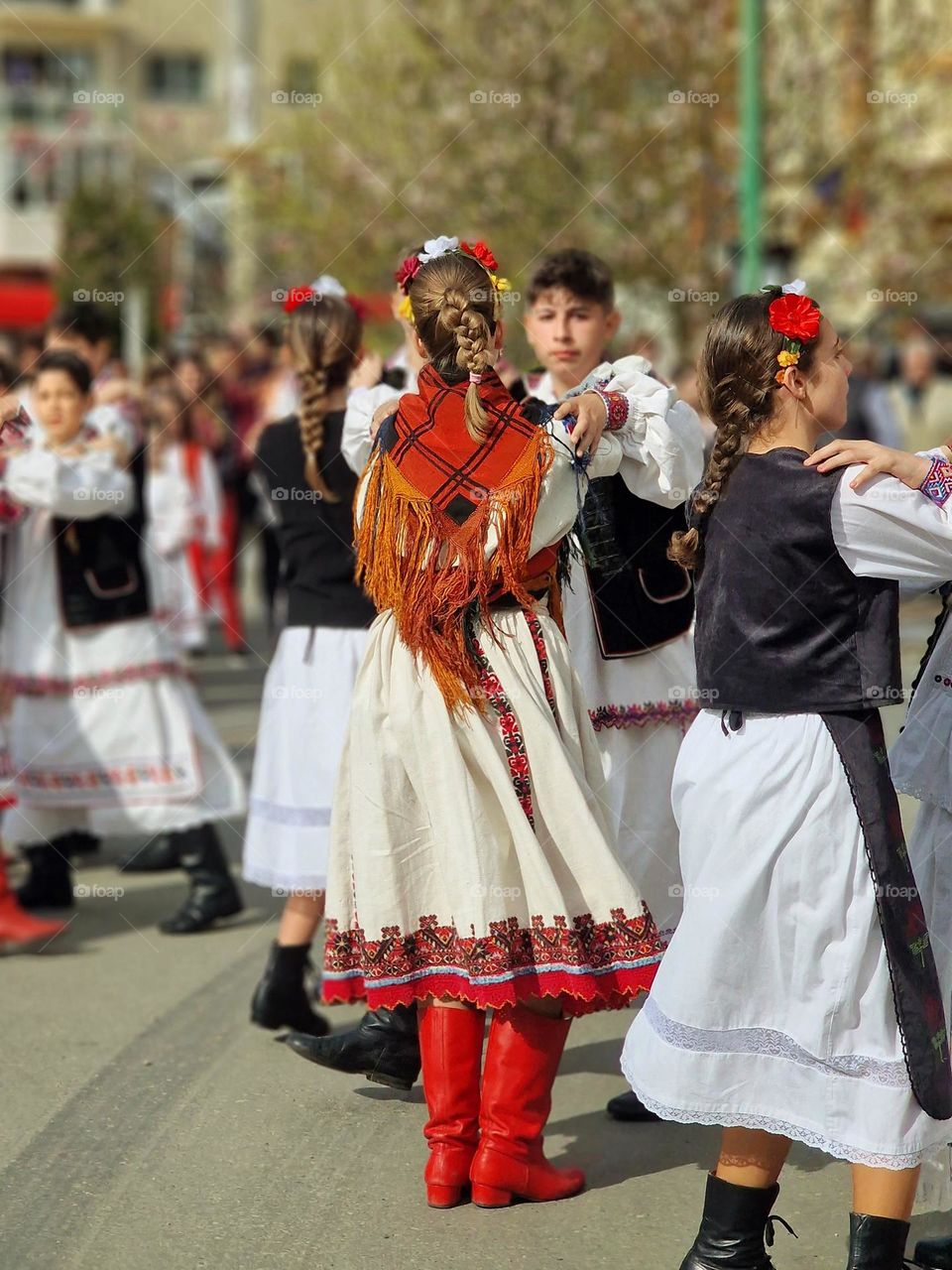 dancing in traditional Romanian costumes