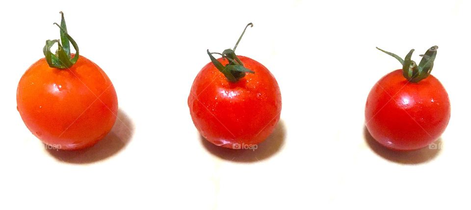 Fresh red tomatoes in a row