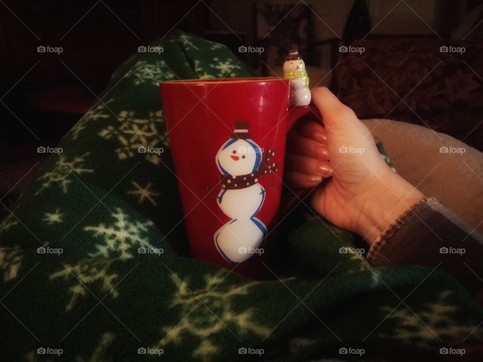 my favorite moment drinking a hot beverage out of my favorite snowman mug snuggled up in a Christmas blanket on a cold winters day