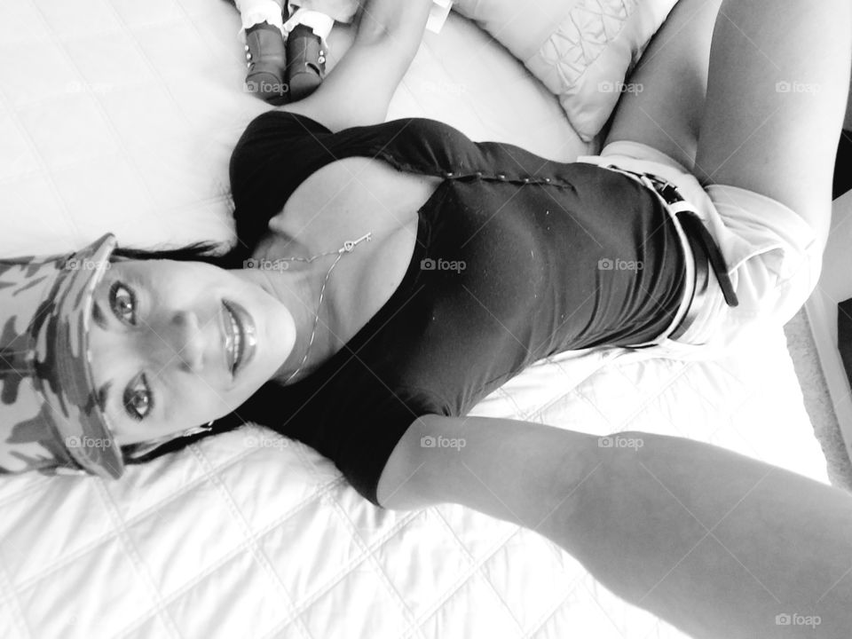 Portrait of african woman lying on bed