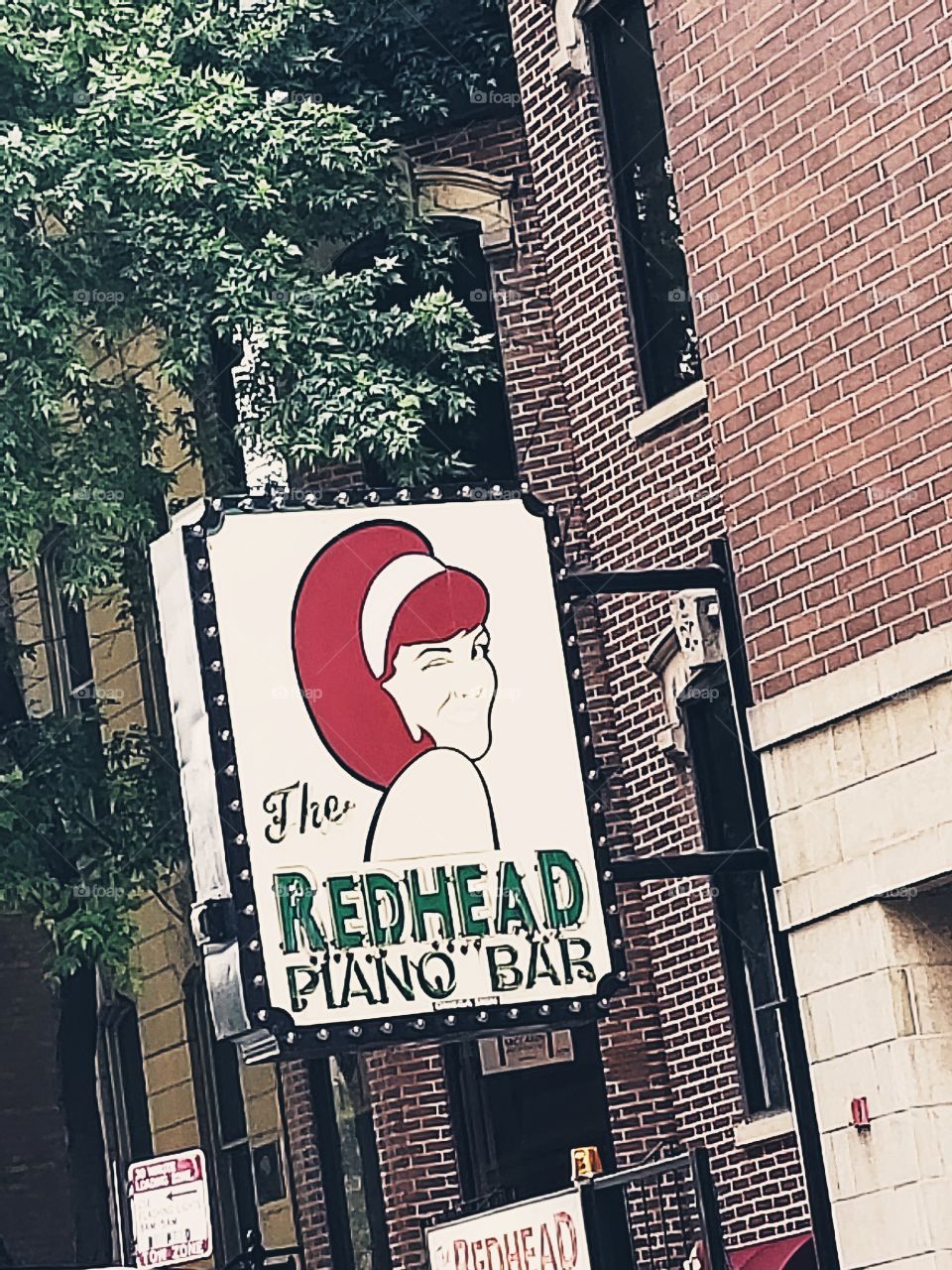 the redhead piano bar sign