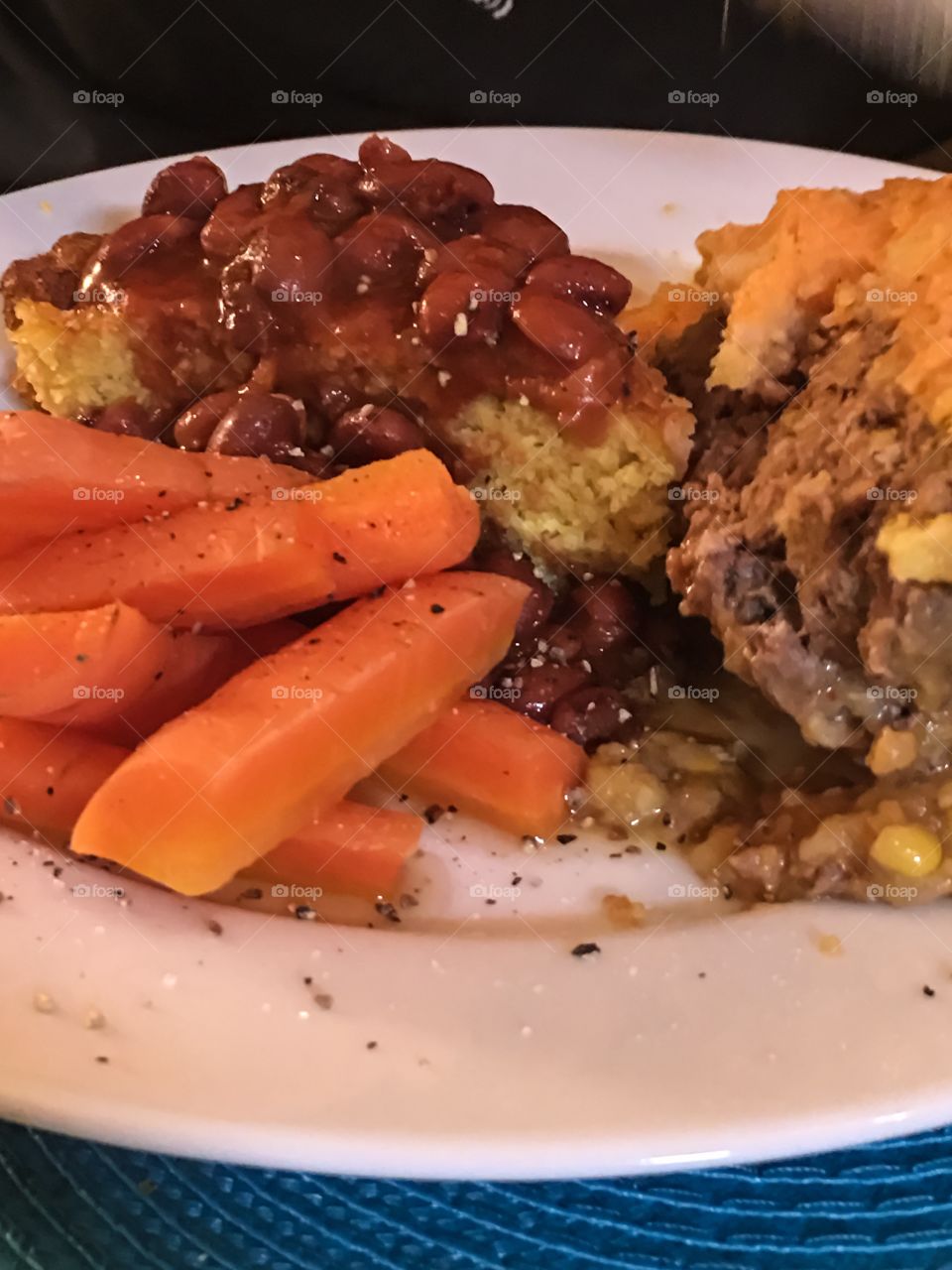 Meatloaf dinner with Mexican chile over homemade cornbread and honey carrots