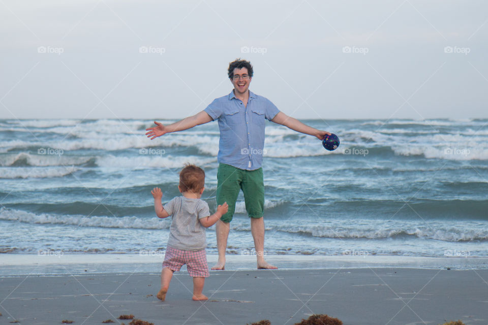 Father and son enjoying on beach