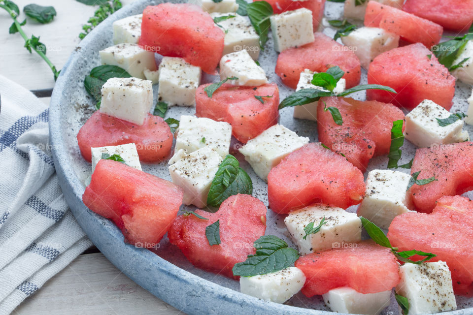 Watermelon and feta cheese with salad