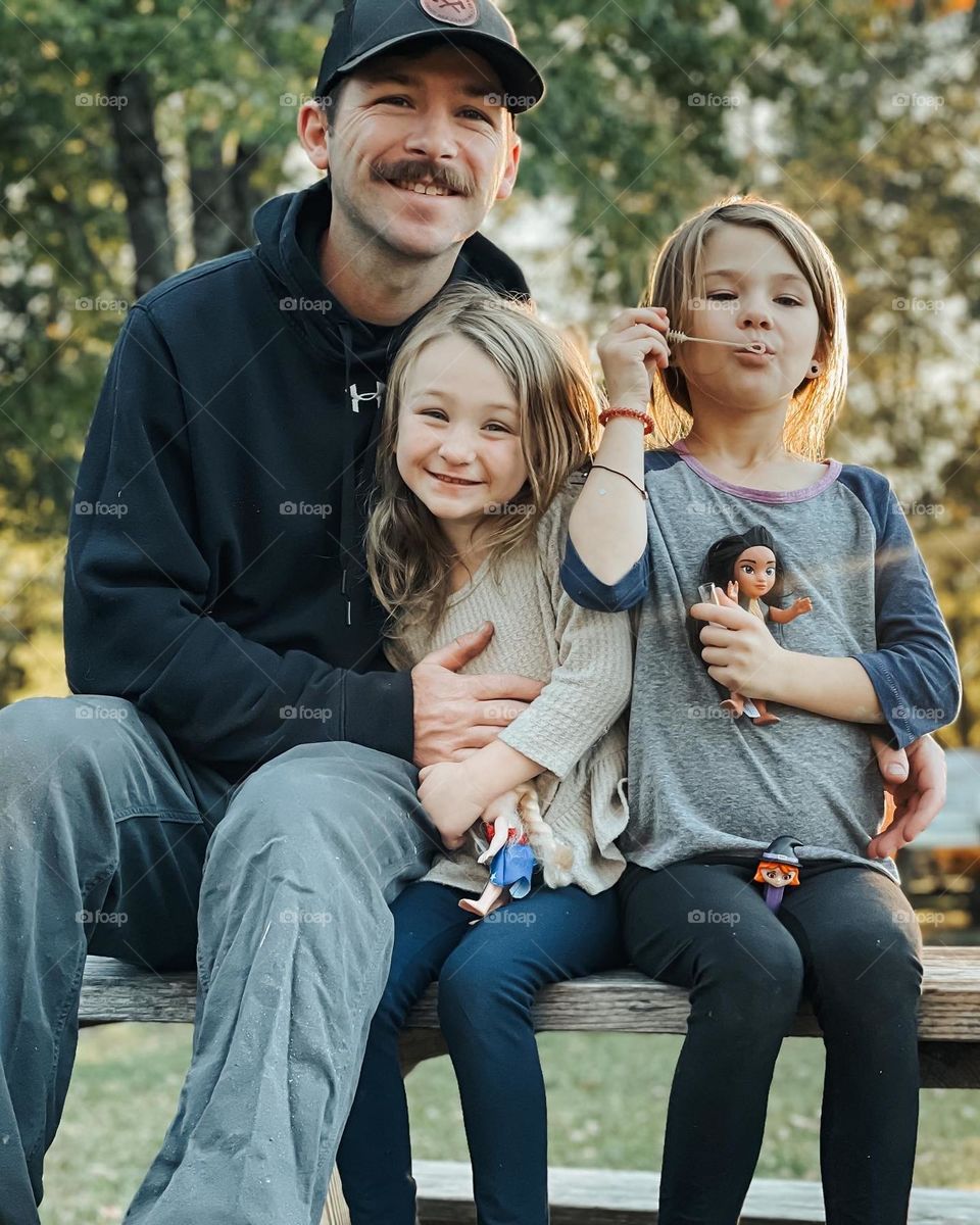 Dad and daughters playing 