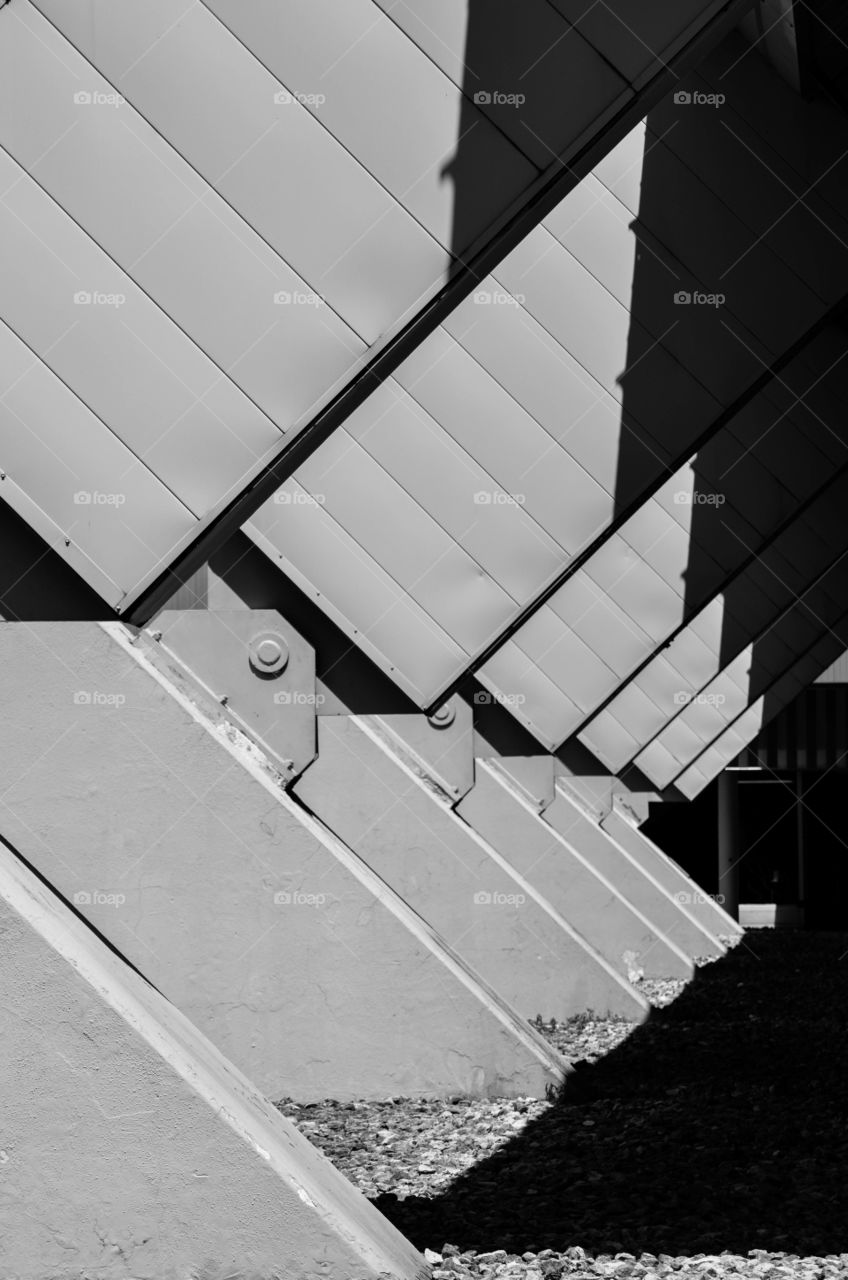 Close-up of a rectangular structure and shadow of a building