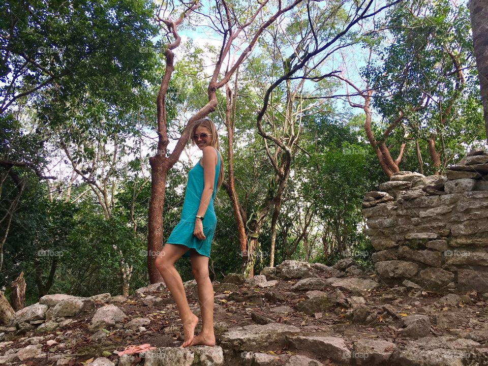 Blonde in a dress in the jungle 