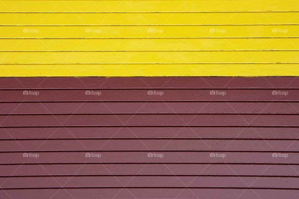 A closeup of a manufacturing company commercial delivery door for loading incoming and outing goods located in Brooklyn, New York City.
