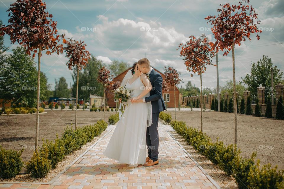 Unforced kiss of the bride and groom in a very beautiful location