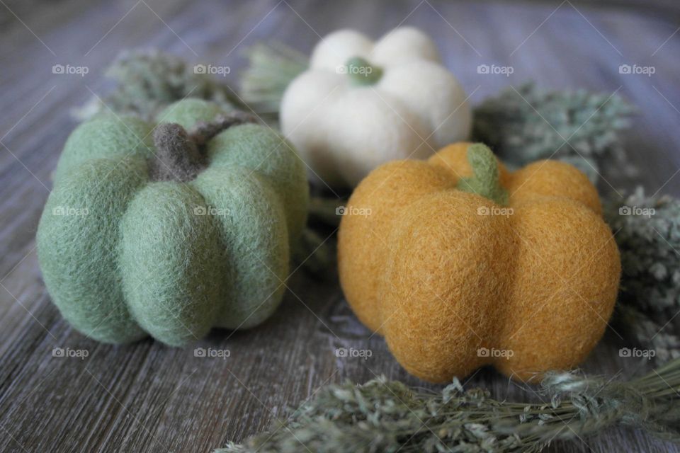 Wool pumpkins on the table