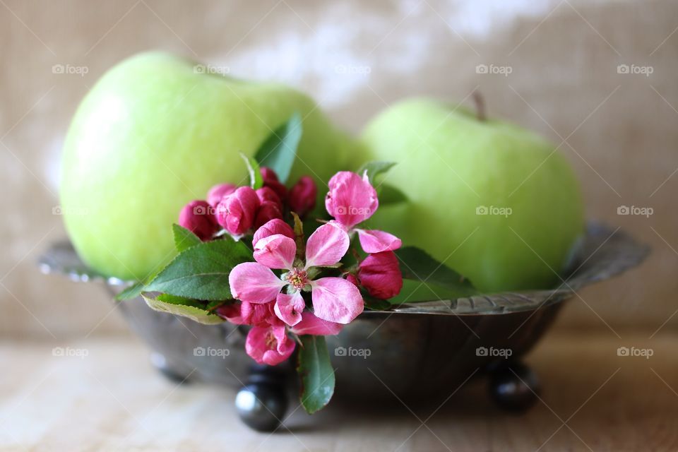 Green apple and flowers