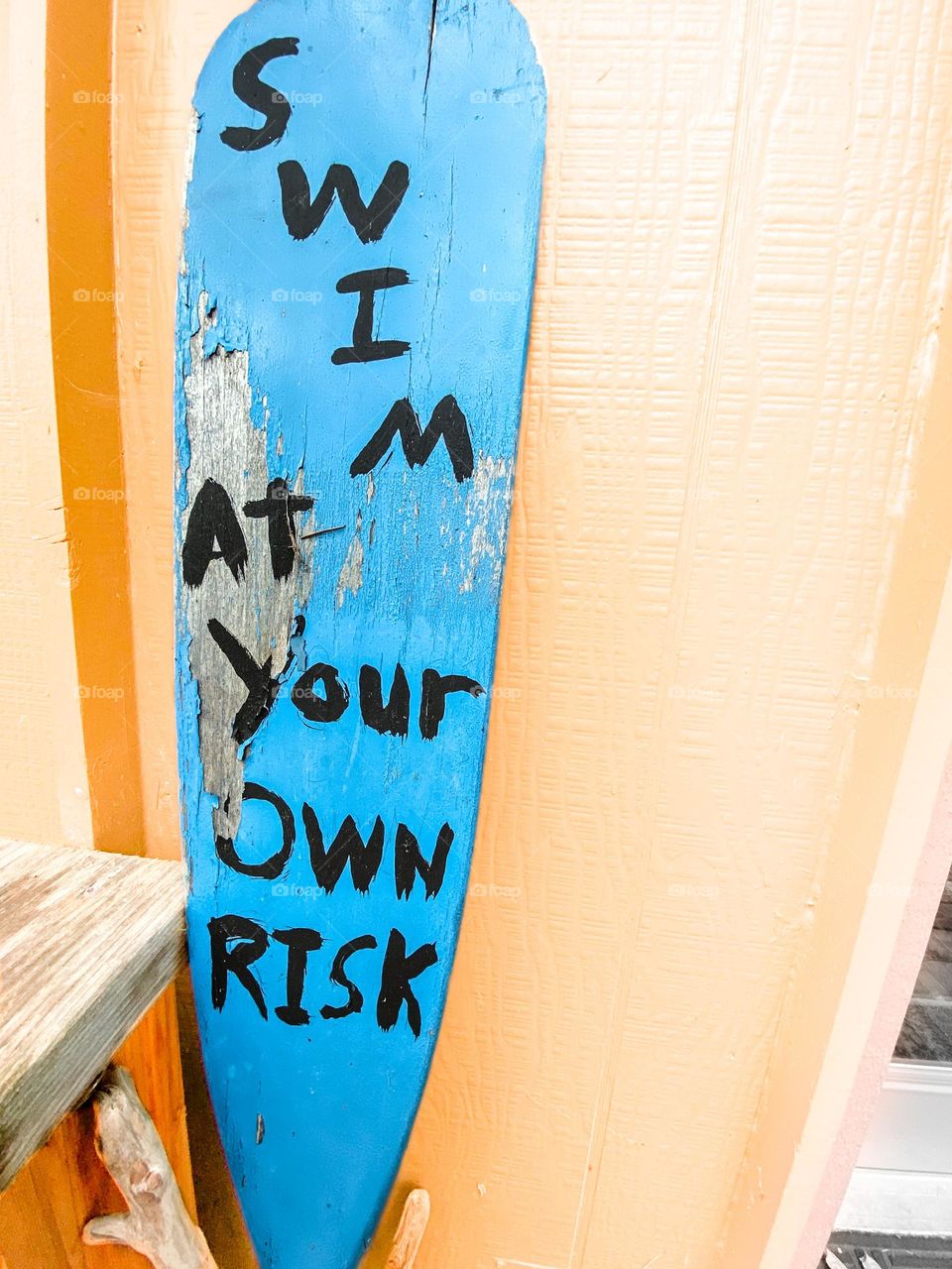 Swimming caution sign at a beach house