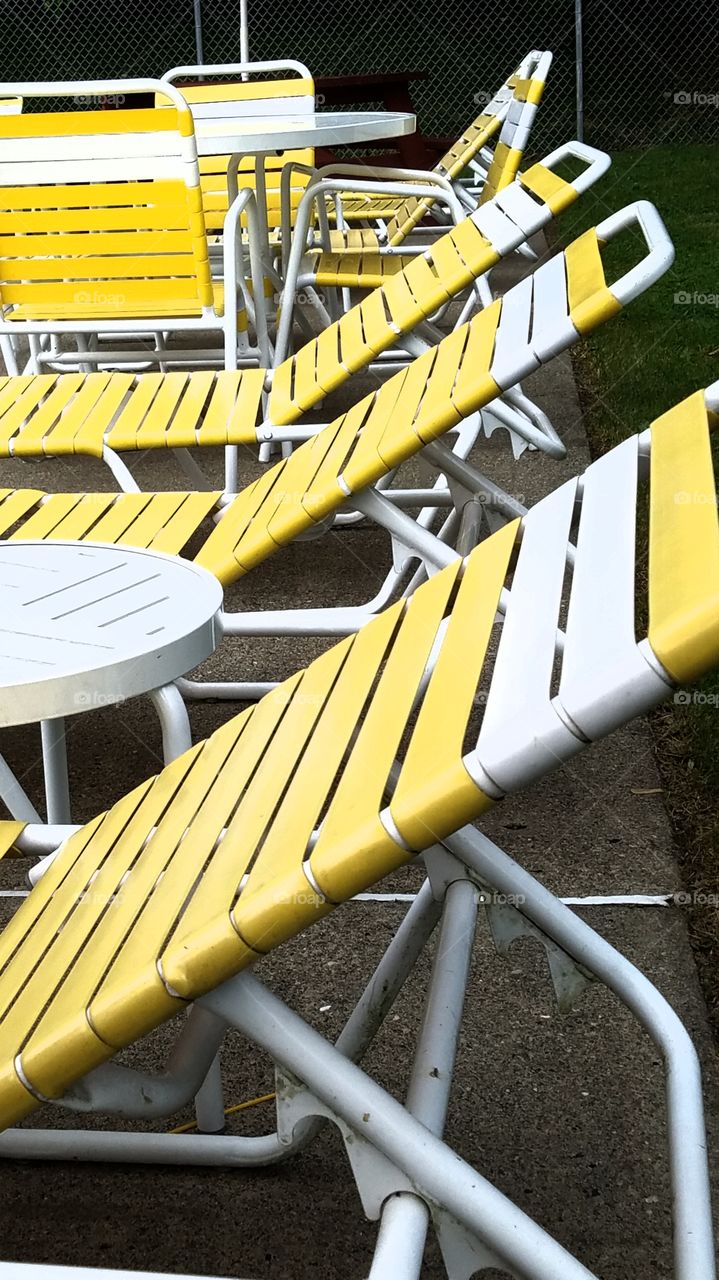 yellow and white pool chairs