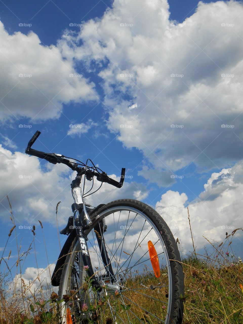 bike blue sky clouds background view from the ground